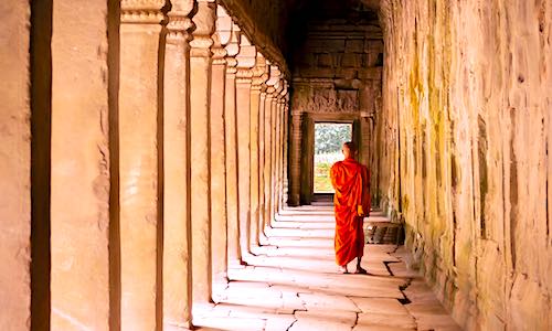 overactive brain lifespan monk with orange robe in hallway