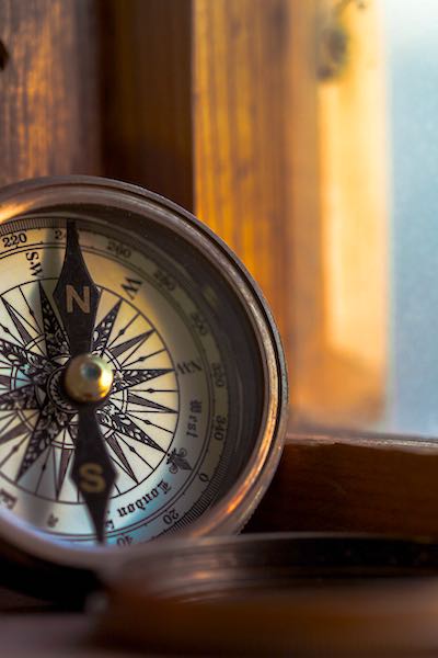 purpose longevity old compass by windowframe