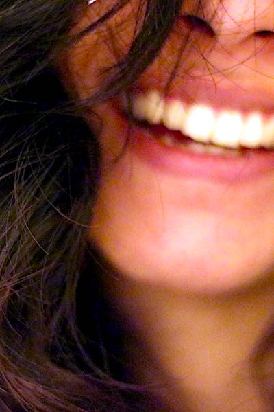 gingivitis alzheimer dark hair woman smiling