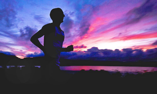 exercise cleans alzheimers brain guy running at sunset