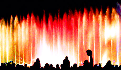 night crowd fountain colored lights