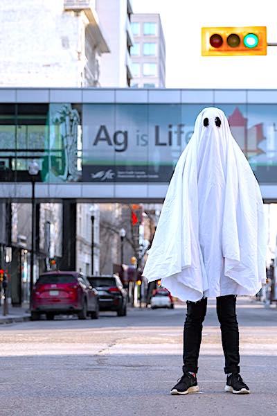 covid-19 antibody duration man dressed as ghost in city