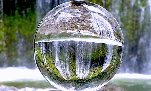get into flow state glass sphere by waterfall