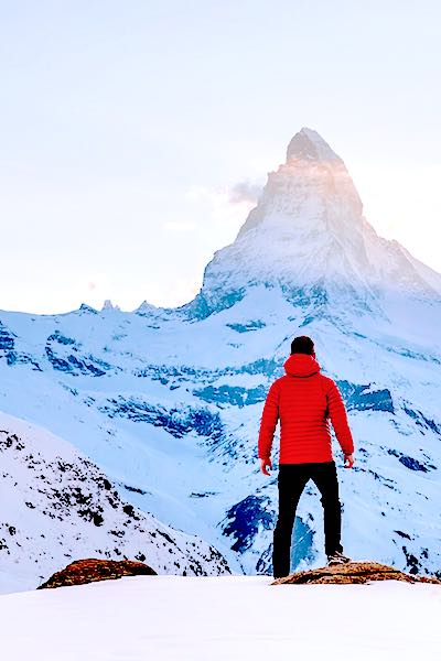 finding meaning health man in red jacket on snowfield by mountain