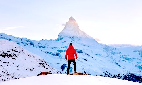finding meaning health man in red jacket on snowfield by mountain