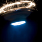 swirling sparkler and light beam black ufo timelapse photo