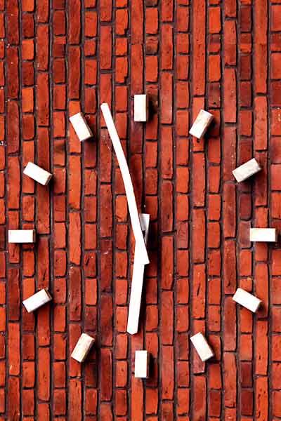 time restricted eating sugar white clock on brick wall