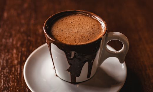 cocoa flavanol stress cup of hot chocolate on wooden table